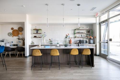 a kitchen with a large island with stools at Arlington Heights 2br w wd gym bbq nr dining CHI-911 in Arlington Heights