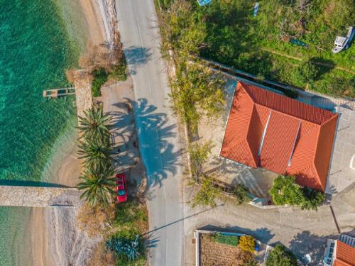 an overhead view of a house and the ocean at Villa Ponar in Kučište