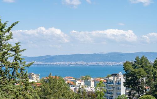 a view of a city and a body of water at Little Villa - walk to the beach in Thessaloniki