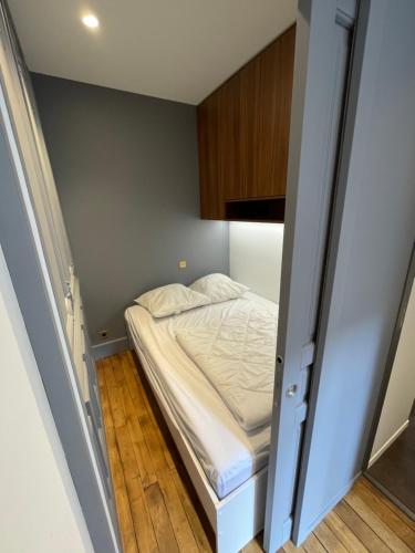 a small bedroom with a small bed in it at Le Sarciron 207 Le Mont Dore in Le Mont-Dore