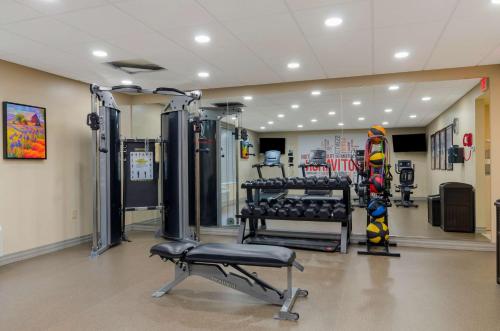 a fitness room with a gym with equipment in it at Best Western North Roanoke in Troutville