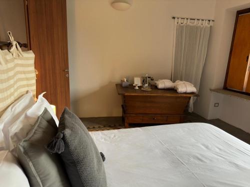 Postel nebo postele na pokoji v ubytování Locanda Il Cortile