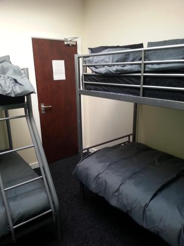 Postel nebo postele na pokoji v ubytování Budget Hostel