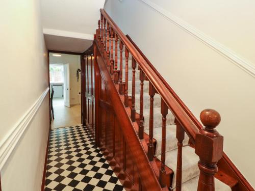 a staircase with a checkered floor in a house at 7 Lonsdale Terrace in Penrith