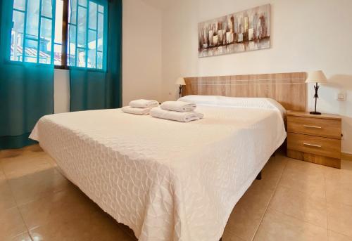 Säng eller sängar i ett rum på Holiday Bungalow with Terrace in Playa del Inglés