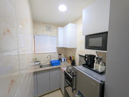 Cucina o angolo cottura di The Leneade - City Centre at Wuse 2