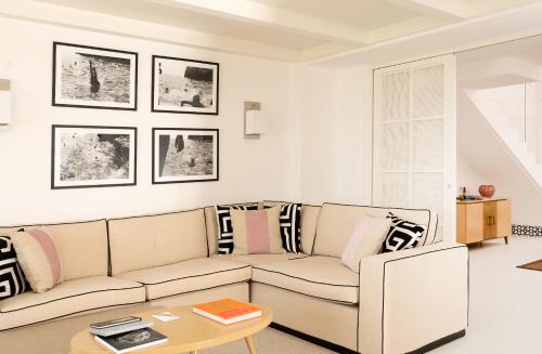 a living room with a couch and a table at Palazzo M Capri in Capri