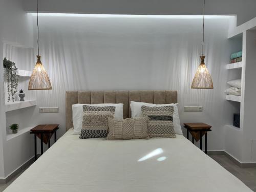 Ένα ή περισσότερα κρεβάτια σε δωμάτιο στο Aleria Central Apartments
