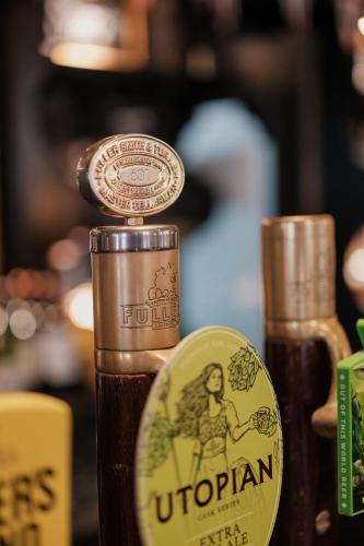 a close up of a bottle of uptonian beer at The Sanctuary House Hotel in London
