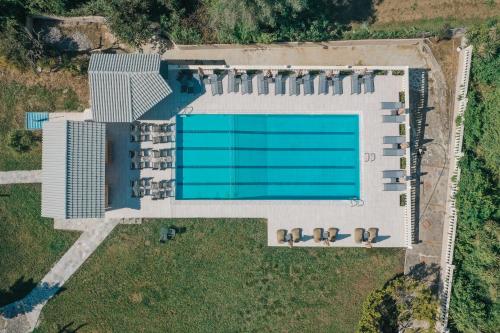 an overhead view of a building with a swimming pool at Pelithea Aparthotel in Corfu