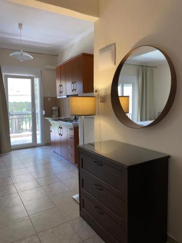 a kitchen with a large mirror on the wall at Villa Vasiliki in Metamorfosi