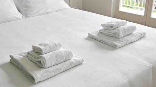 Postel nebo postele na pokoji v ubytování Hotel Corte Santa Libera