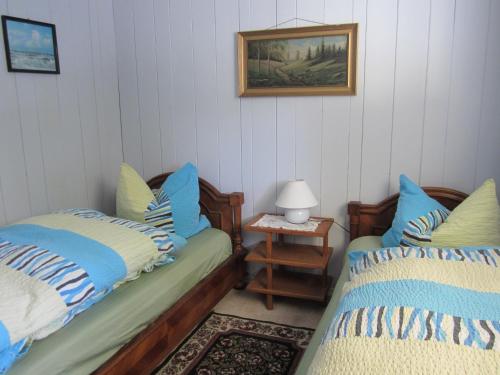 מיטה או מיטות בחדר ב-The Cozy Cubbyhole B&B