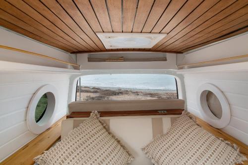 a view from the inside of an rv with two pillows at Inikcamper in Ingenio