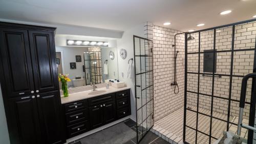 a bathroom with a sink and a shower at Sunset Tides in Oak Haven