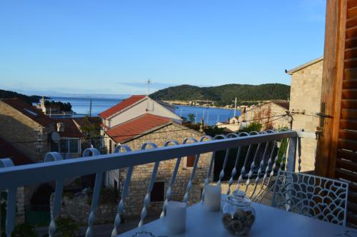 a view from the balcony of a house at Studio apartman Tomi - seaview in Vis