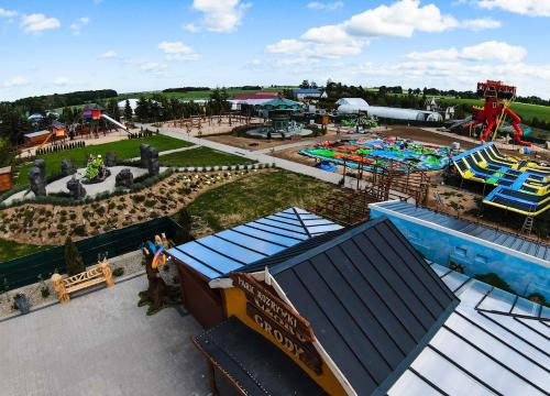 an aerial view of an amusement park with a water park at Całoroczny domek - bliźniak in Mrzezino