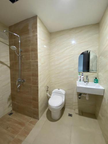 a bathroom with a toilet and a sink and a shower at FORMOSA RESIDENCE NAGOYA -The Apartments 1 Bed Room 173A in Nagoya