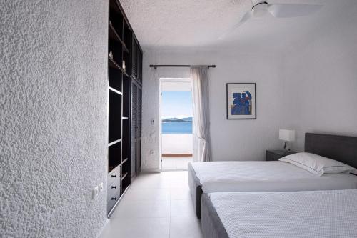 Ένα ή περισσότερα κρεβάτια σε δωμάτιο στο Luxury Villas Skiathos