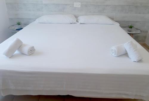 En eller flere senge i et værelse på Hotel Montemar