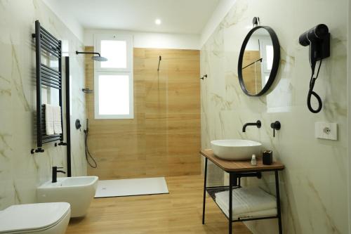 a bathroom with a sink and a mirror at Enea Suite in Trapani