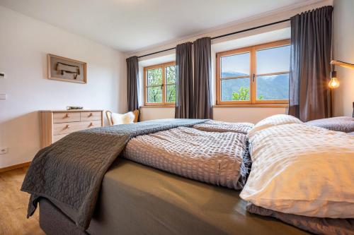 a bedroom with two beds and a window at Valentin36 Apartment Raschötz in Funes
