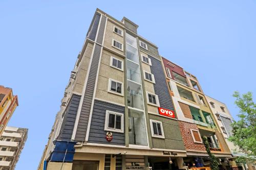 a tall building with a sony sign on it at Super Hotel O Honey Heights Near Botanical Garden in Kondapur