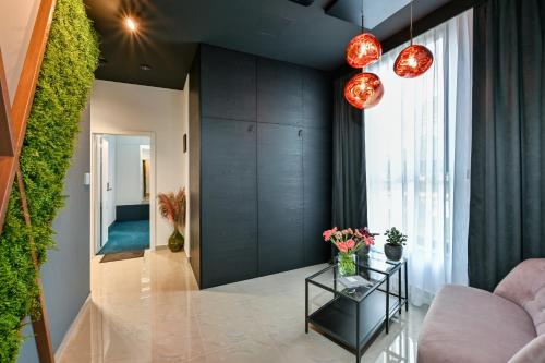 a living room with a couch and a table at Rooms Florek & Florica in Križevci