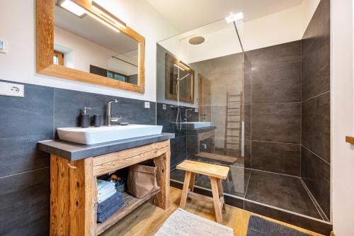 a bathroom with a sink and a shower at Valentin36 Apartment Geisler in Funes