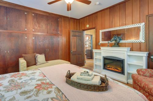 a bedroom with a fireplace and a bed with a basket on it at Quiet Ellaville Home with Patio and Outdoor Dining! 