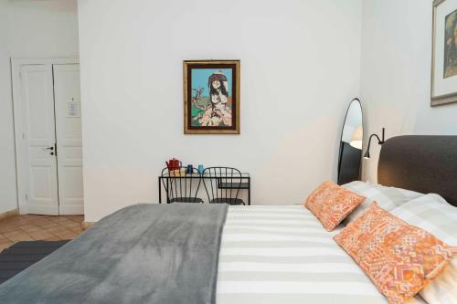 a bedroom with a bed and a table at B&B Bellini in Milo