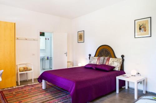 Un pat sau paturi într-o cameră la Casina Orbetello