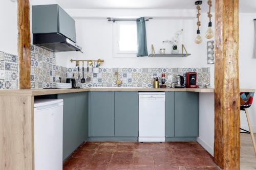 Η κουζίνα ή μικρή κουζίνα στο Elégant Appartement avec balnéo à 100m du Capitole