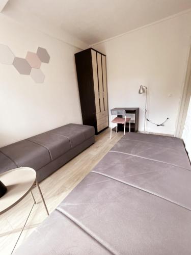 a living room with a bed and a table at Aparthotel Monterria in Bar