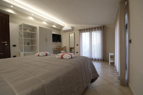 Ένα ή περισσότερα κρεβάτια σε δωμάτιο στο Come a Casa Bed And Breakfast