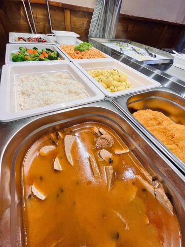 a buffet with a lot of different types of food at Penzion Katarina in Ždiar