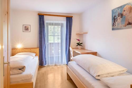 Postel nebo postele na pokoji v ubytování Stablerhof Apt Löwenzahn