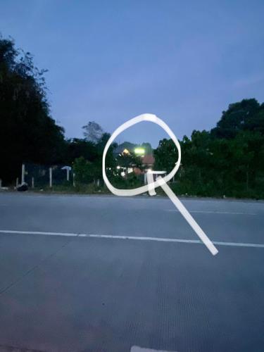 a mirror sitting on the side of a road at Hai Inn in Dumaguete