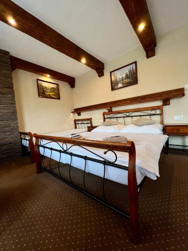 a bedroom with two beds in a room at Penzion Katarina in Ždiar