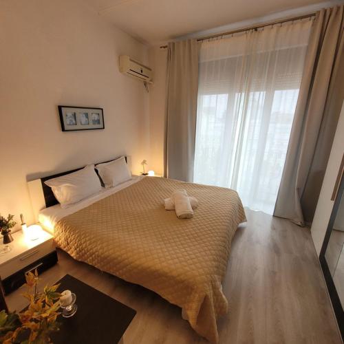a bedroom with a bed with a towel on it at Anastasia Apr 28B Beautiful View in Bucharest