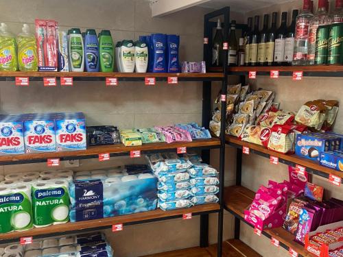 a store shelf filled with different types of toiletries at Apartments Zuto in Ulcinj