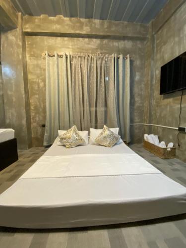 Postel nebo postele na pokoji v ubytování Hai Inn