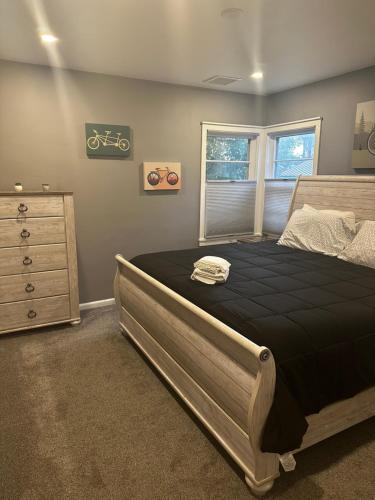 a bedroom with a bed and a dresser at Cyclist Retreat in downtown Fruita, Colorado in Fruita