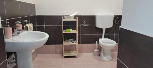 a bathroom with a sink and a toilet at Dimora Vanvitelli in Caserta