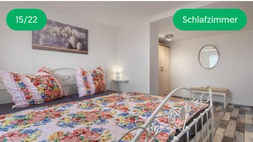 a bedroom with a bed with a colorful blanket at Schloßblick in Blankenburg