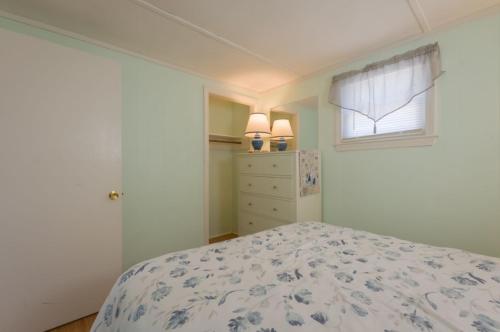 a bedroom with a bed and a window at 131 #3 North Shore Boulevard East Sandwich - Waters Edge #3 in Sandwich