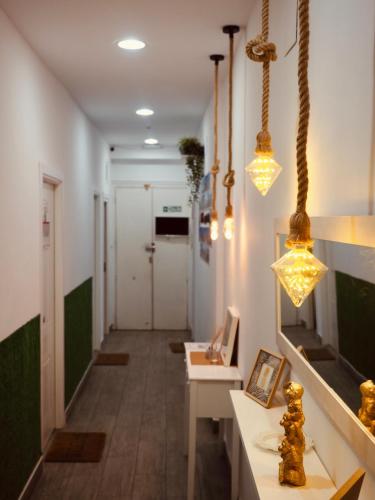 a hallway with two lights and a hallway with a table at Apartment in the Center of Madrid in Madrid