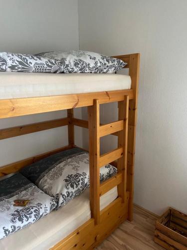 a couple of bunk beds in a room at Ferienwohnung Franzi in Goslar