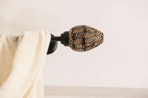 a black and white rope hanging from a curtain rod at Dimora Cummà Marì in Vieste