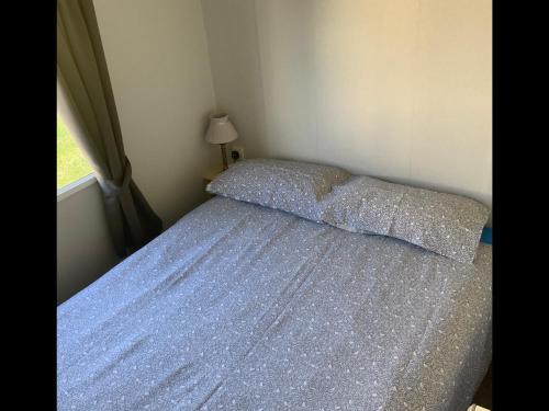 a bedroom with a bed covered in sparkles at HAVEN THORPE PARK 6 Berth Caravan in Cleethorpes Waterside FREE WI FI in Cleethorpes
